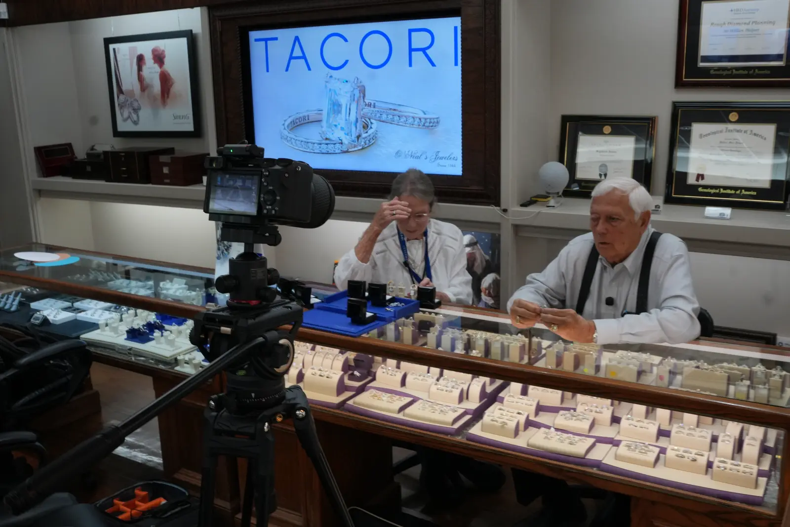 A camera on a tripod set up to interview the owners of O'Neal's Jewelers in Pauls Valley, Oklahoma, behind their ring counter